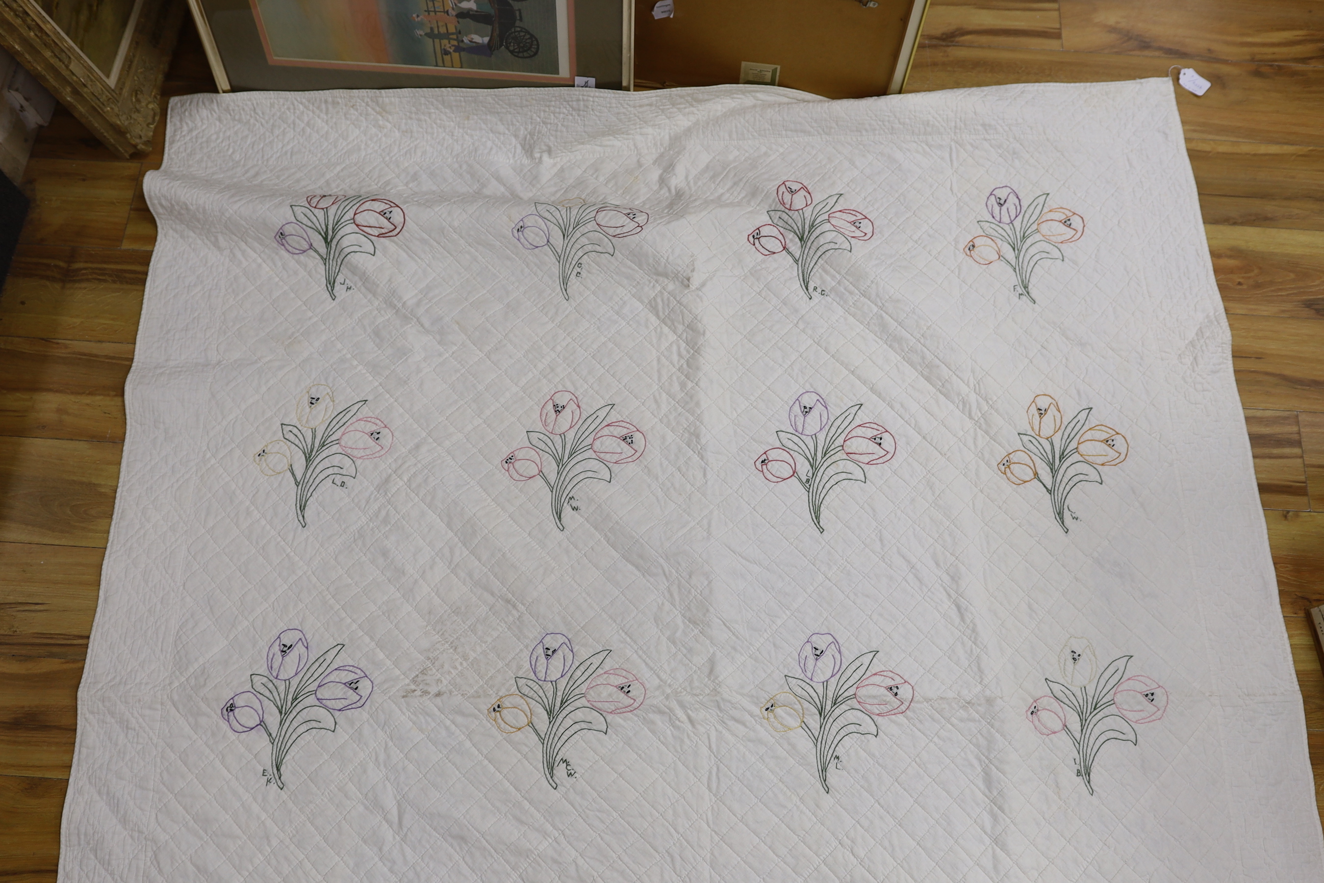 A 1920's American friendship dowry quilt embroidered with flowers, initialled